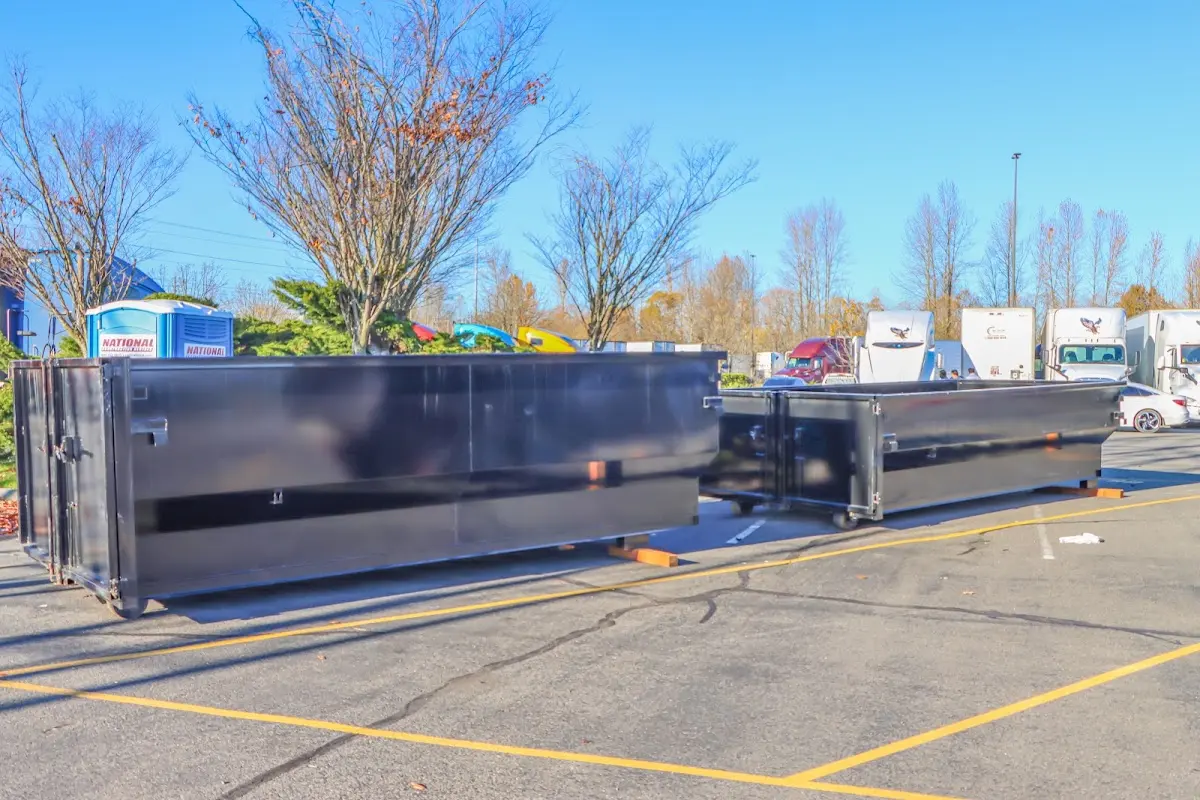 Professional dumpster rental service with roll-off container on residential driveway in Difficult Run